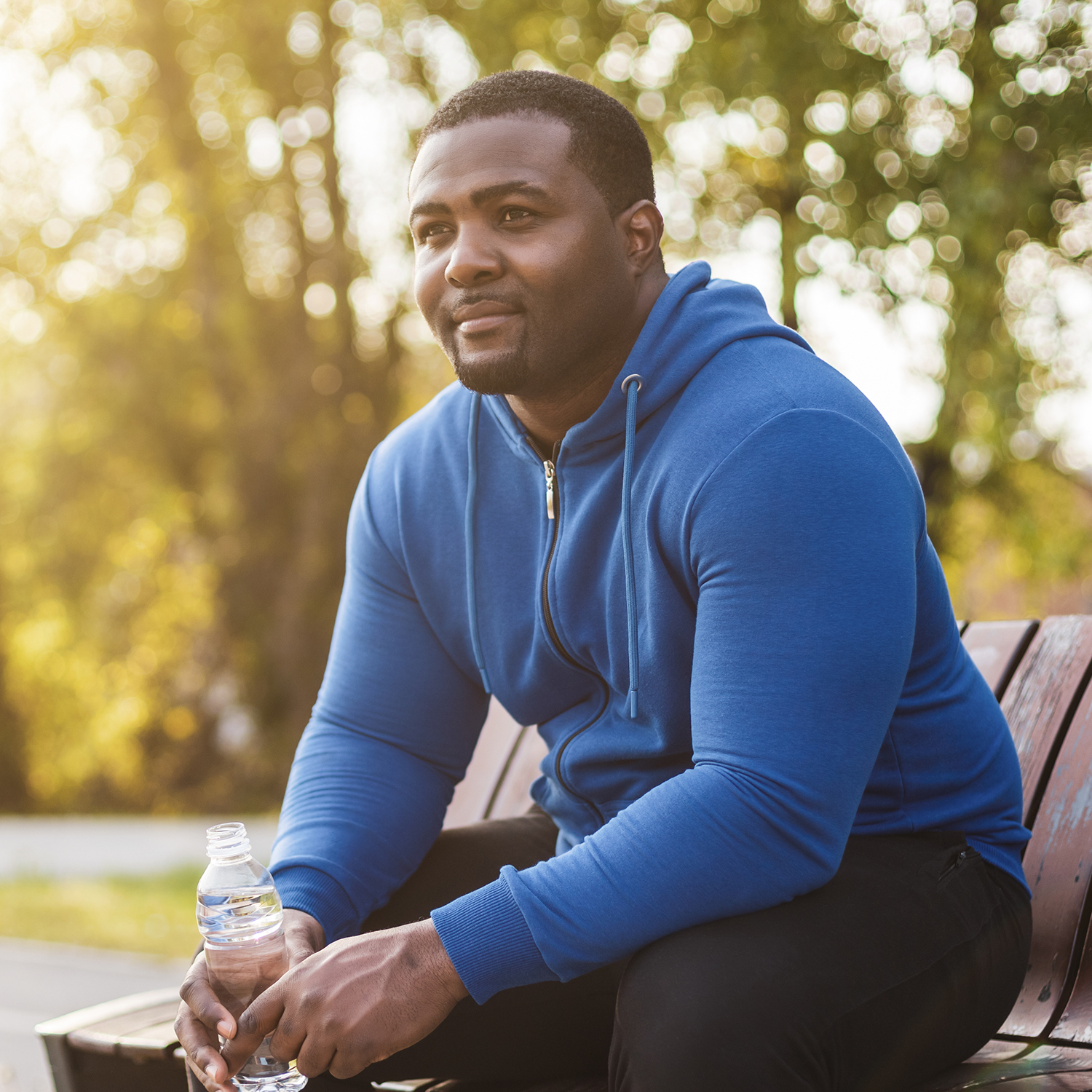 Man resting after exercise and drinking water